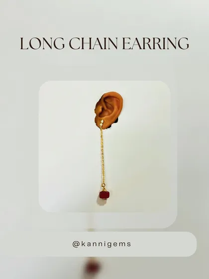 Turn ordinary moments into extraordinary ones with these stunning long-chain earrings with a detachable red stone. They bring a pop of color and personality to any outfit.