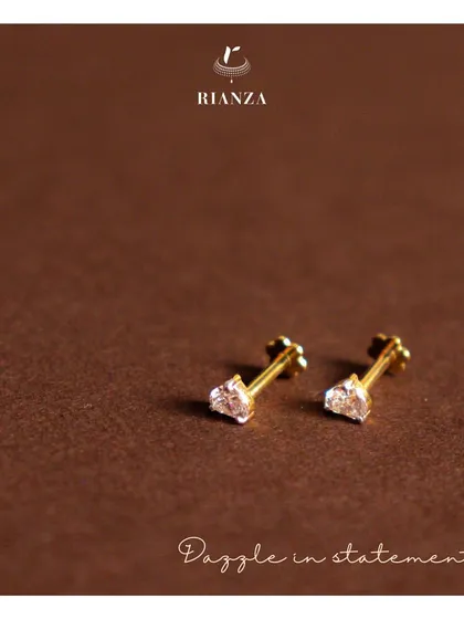 Our timeless diamond studs, captured here to show their sparkle. These are a perfect gift and a foundational piece for anyone starting their fine jewellery collection.