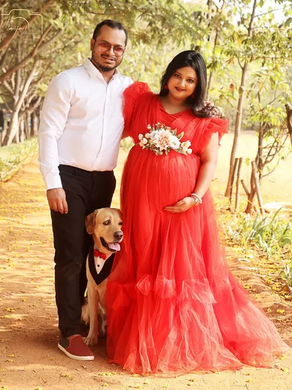 Another shot with their furry family member. The joy and love in this photo are palpable.