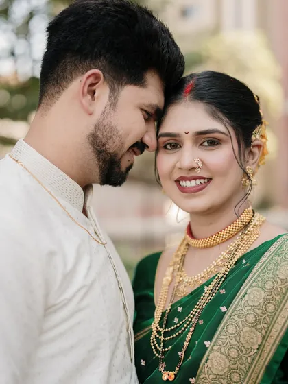 An intimate close-up where two worlds meet. This portrait highlights the couple's connection, with the groom's gentle touch and the bride's trusting gaze, creating a powerful emotional narrative.
