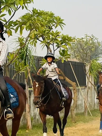Students from Uma Public School enjoying a group riding lesson on a sunny morning. Our program emphasizes horsemanship and teamwork for young, aspiring equestrians.