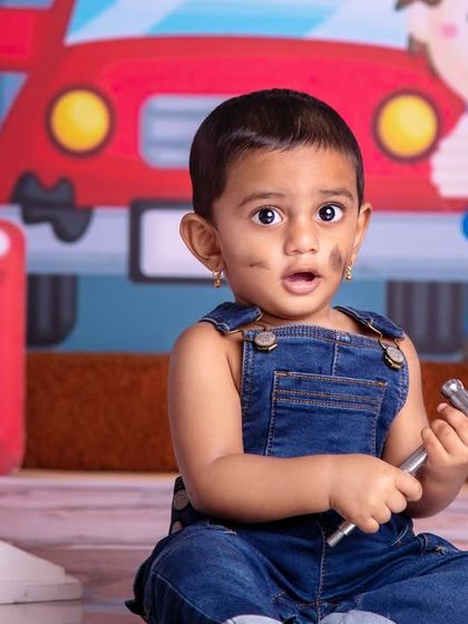 Little wrenches, big adventures! This tiny mechanic looks surprised but ready for the job in his cute overalls.