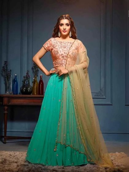 Rent, wear, and shine in our beautiful occasion wear. This teal and peach lehenga is perfect for creating beautiful memories at any celebration.