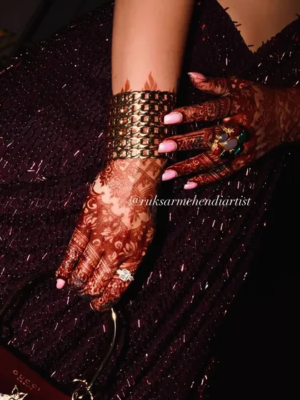 A stylish shot of the developed henna stain, paired with a beautiful cuff bracelet. My henna looks great with all your bridal accessories.
