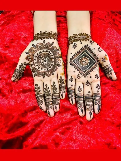 A simple yet striking design with two different mandalas. One is circular and the other is diamond-shaped, showing how basic shapes can create a modern and artistic look.