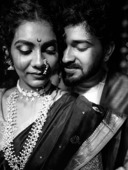 A stunningly intimate black and white close-up of a Maharashtrian couple, their eyes closed in a moment of quiet connection.