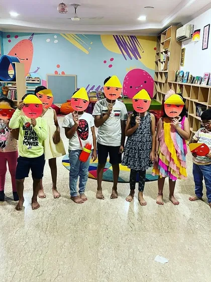 The whole group proudly displaying the Ravan masks they created for Dussehra. It's wonderful to see their collective creativity.
