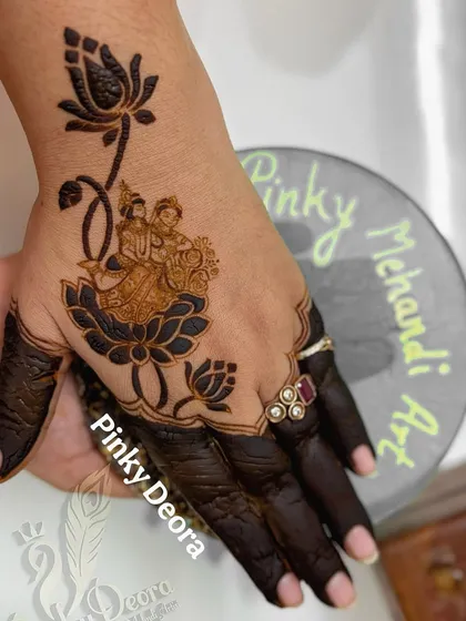 A full view of the Radhe-Krishna and lotus design I created on my own hand. It's a mix of divine love and personal creativity.