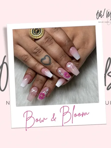Bows and blooms for a sweet and pretty vibe. This design features a soft pink and white ombre base, adorned with delicate 3D bows and floral details.
