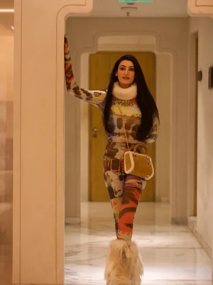 Another full-length view of the Yeti look, showcasing the Dior bag and Bogner boots. Every accessory was chosen to complement this unique and memorable outfit.