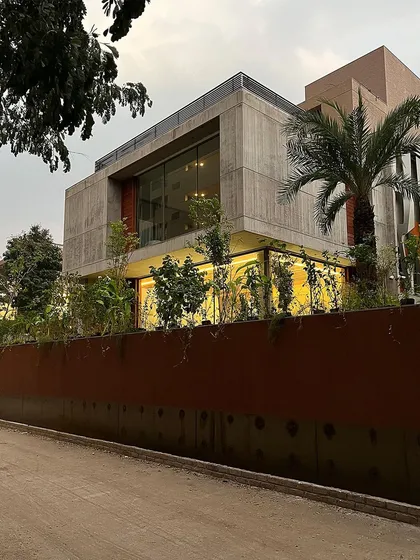 This home appears to float on a bed of green. We used dense, layered planting, from ground cover to mature trees, to envelop the structure in nature.