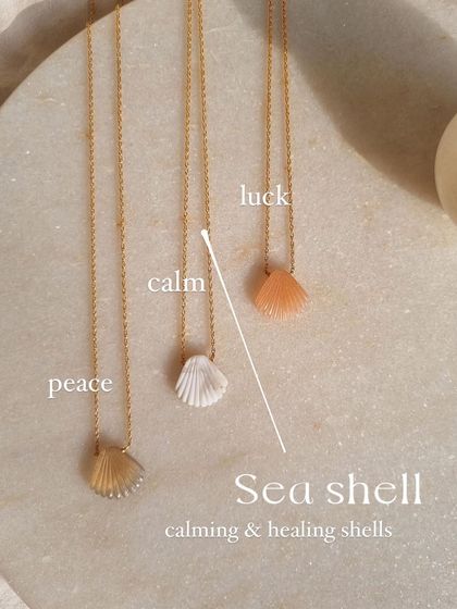 A collection of my seashell pendants, in Howlite for calm and Peach Moonstone for luck.