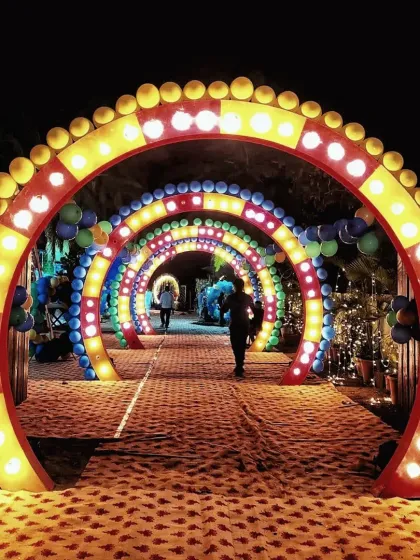 I also design creative and high-energy entrances. This colorful, carnival-style light tunnel was built for a party, using a series of arches with bold lighting to create a fun and memorable entryway for guests.