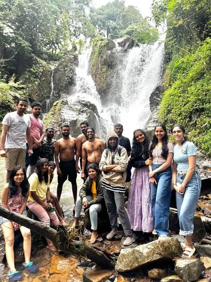 Another happy group enjoying the cool waters of a waterfall, a highlight of our multi-trek weekend adventure.