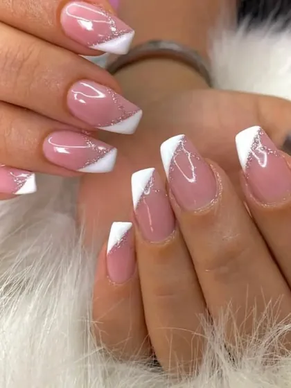 Another angle of the angular white French tip with a silver glitter line, showing the clean lines and sparkle.