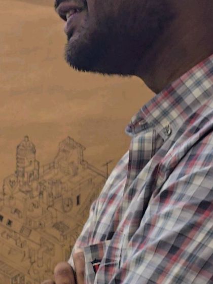 Ajith standing with his work. Though he remained dissatisfied, thinking it sketchy and incomplete, his work was a surprise to many and a testament to his unpredictable talent.