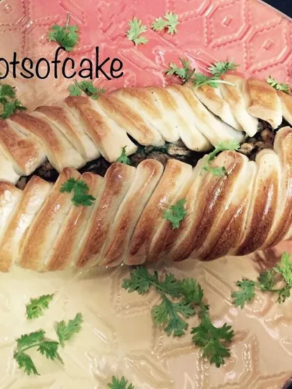 Who says pizza has to be round? This is my braided chicken pizza, stuffed with seasoned chicken and herbs. It's a real showstopper on the table and tastes just as amazing as it looks.