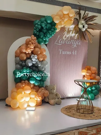 We design modern and chic decor for adult birthdays. This 41st birthday setup uses a trendy boho theme with a sophisticated palette of muted and earthy-toned balloons, a custom arched backdrop, and natural textures.
