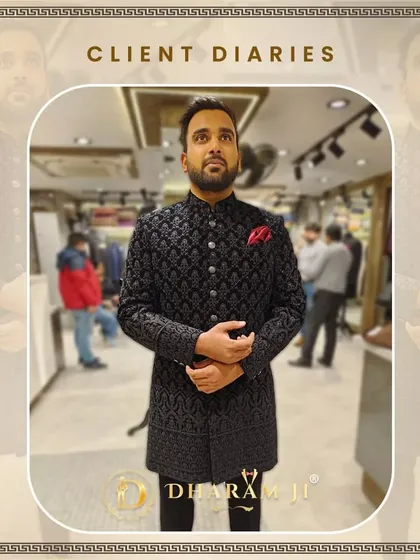 A client looking distinguished in a black embroidered sherwani. The fit is perfect, and the red pocket square adds a nice pop of color.