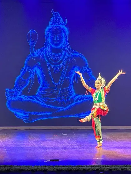 For this Odissi Manch Pravesh, or debut performance, we used a stunning LED backdrop of Lord Shiva to create a divine atmosphere. My job as a director is to ensure every element, from lighting to visuals, supports the dancer's artistry.