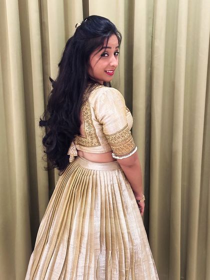 A view of the back of the blouse, showing the detailed embroidery and the pretty tassels. I believe every part of the outfit should be special, including the back design.