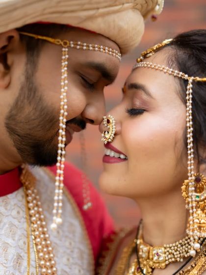 An intimate close-up of a Maharashtrian bride and groom.