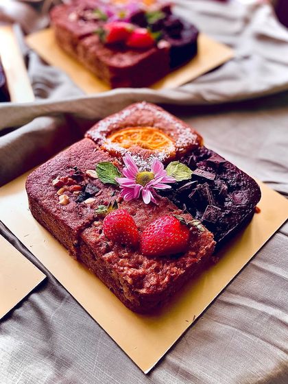 A closer look at one of the 4-in-1 cake boxes, showing the variety of textures and toppings.