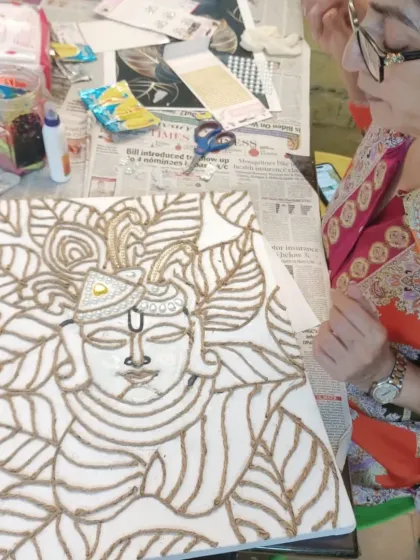 A work in progress, this student is creating a beautiful Krishna artwork using jute rope for the outlines, an interesting mixed-media technique.