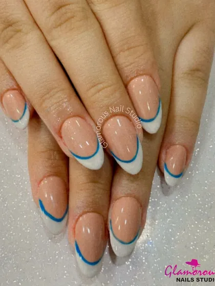 We believe even classics can have a modern twist. Here, we've updated the timeless French manicure with a clean white tip and a sharp, electric blue line for a look that is chic, clean, and totally unique. It's a perfect example of minimalist design with maximum impact.