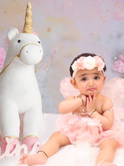 A sweet and shy moment with a unicorn friend. Our fairy and unicorn themes are perfect for capturing the gentle and imaginative spirit of childhood.