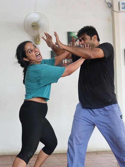 A moment of physical comedy during a "Gretel" rehearsal.