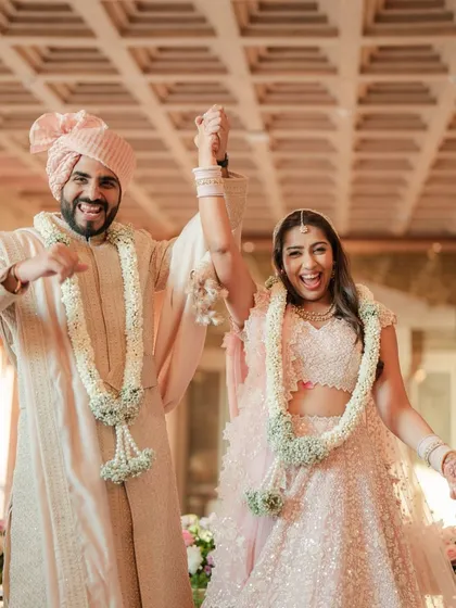 The newly married couple makes their exit, their faces beaming with joy and excitement for their new life together.
