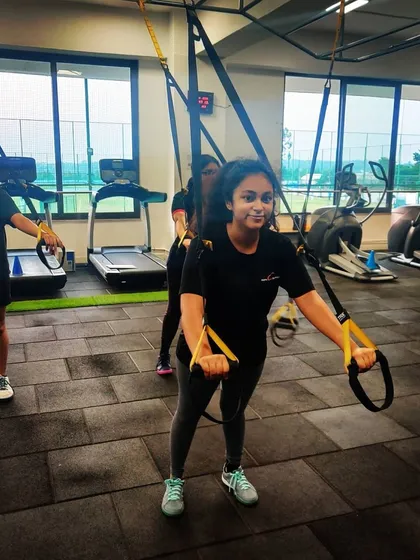 A young shooter participates in a strength and conditioning session. We ensure our athletes develop the physical foundation required to sustain long hours of focused competition.