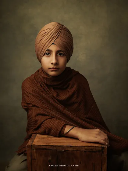 A similar pose in color, with the rich brown tones creating a warm and inviting mood. These portraits are designed to be timeless works of art.