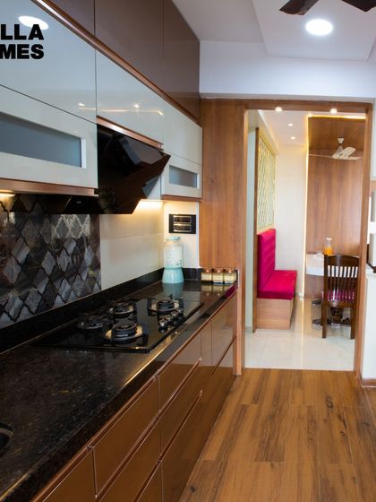 Another angle of the Kazi family's kitchen, showing the patterned tile backsplash and the efficient layout.