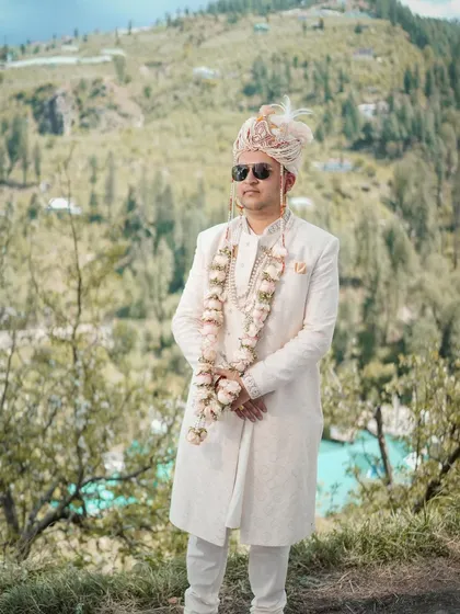 A groom stands against the stunning backdrop of the Jubbal valley. My goal is to make my portraits feel both personal and epic, integrating the character of the location.