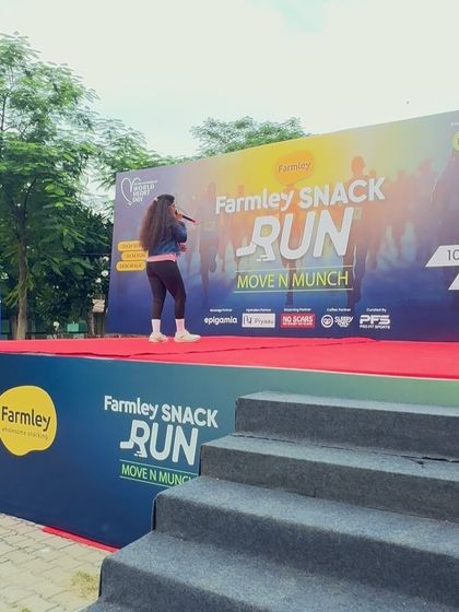 On stage at the Farmley Snack Run, getting the crowd ready for a great event.