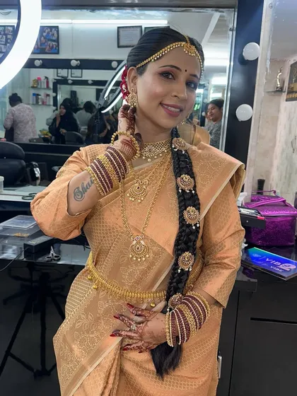 Another pose showing the beautiful details of the hairstyle and jewellery.