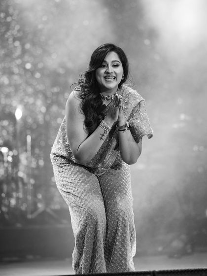 A black and white photo capturing the pure happiness of a performer after her dance.