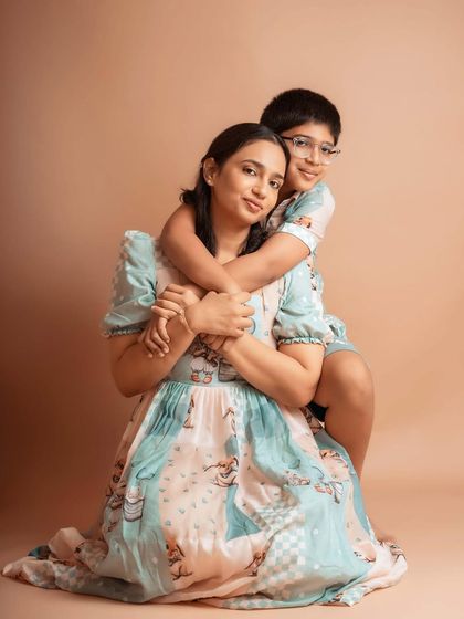 A loving hug from her older son. Capturing the individual relationships within a family is just as important as the group shot.