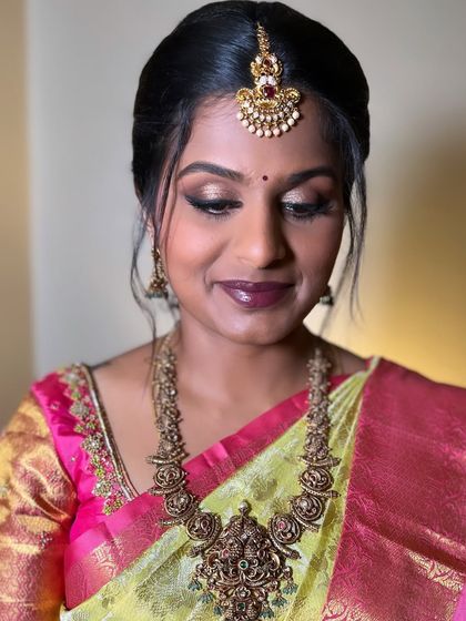 Another angle of Akshaya's beautiful look. The skin is kept radiant and fresh, allowing the focus to be on her expressive eyes and rich lip color.