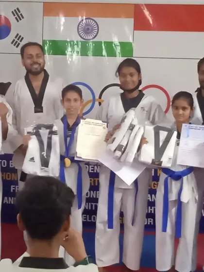 Another angle of our students with their new uniforms and certificates, celebrating their hard-earned success.