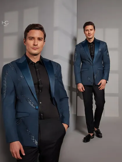 I reimagined cocktail wear with this piece. The deep blue jacket features satin lapels and abstract silver embroidery, creating a look that is both artistic and elegant.