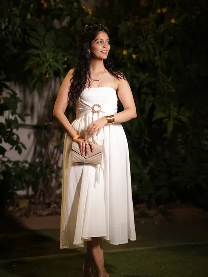 Another angle of the white dress, showing its beautiful flow and silhouette. I always consider how an outfit moves when I select it.