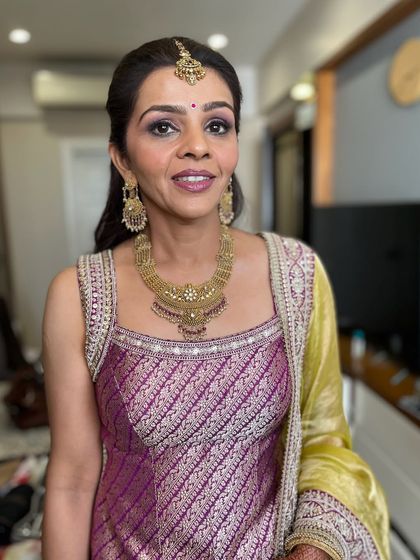 A smiling portrait showing off this pretty and fresh makeup. It's a perfect example of how to do event makeup that feels light and looks natural.