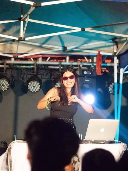 A candid shot of me enjoying the music as much as the crowd. My passion for the music is infectious, and it translates into the energy I bring to every performance.