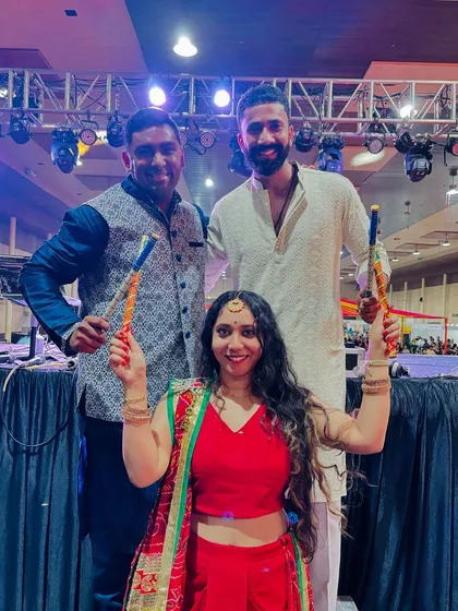 Posing with guests and their dandiya sticks. Connecting with the crowd and sharing in the fun is a huge part of what makes these nights special.