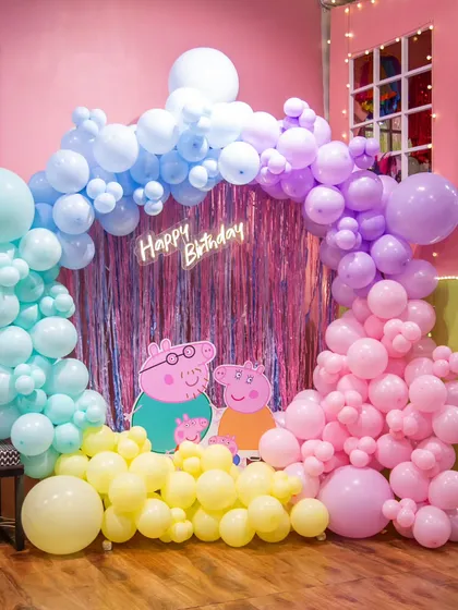 I love bringing cartoon worlds to life! This Peppa Pig theme features a custom pastel balloon arch and character cutouts for a fully immersive experience.