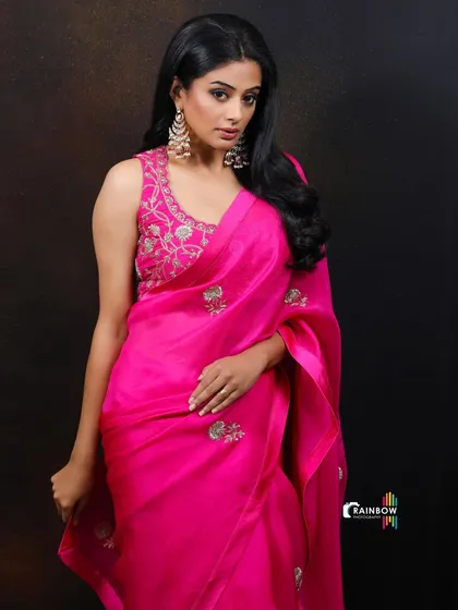 Another elegant shot of Priyamani. The over-the-shoulder pose is a classic way to showcase both the actress and the designer outfit.