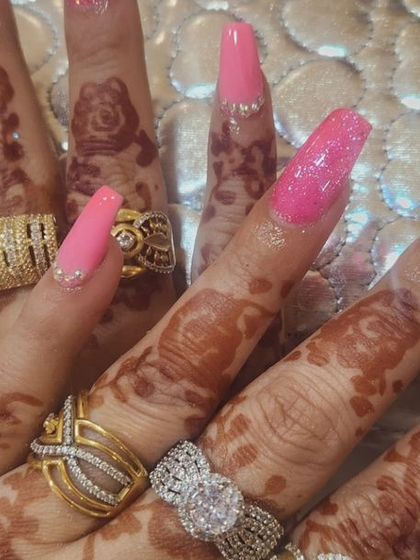 Go bold with this vibrant pink manicure on long, square extensions. I used a mix of glitter and rhinestones to create a super sparkly, eye-catching look.